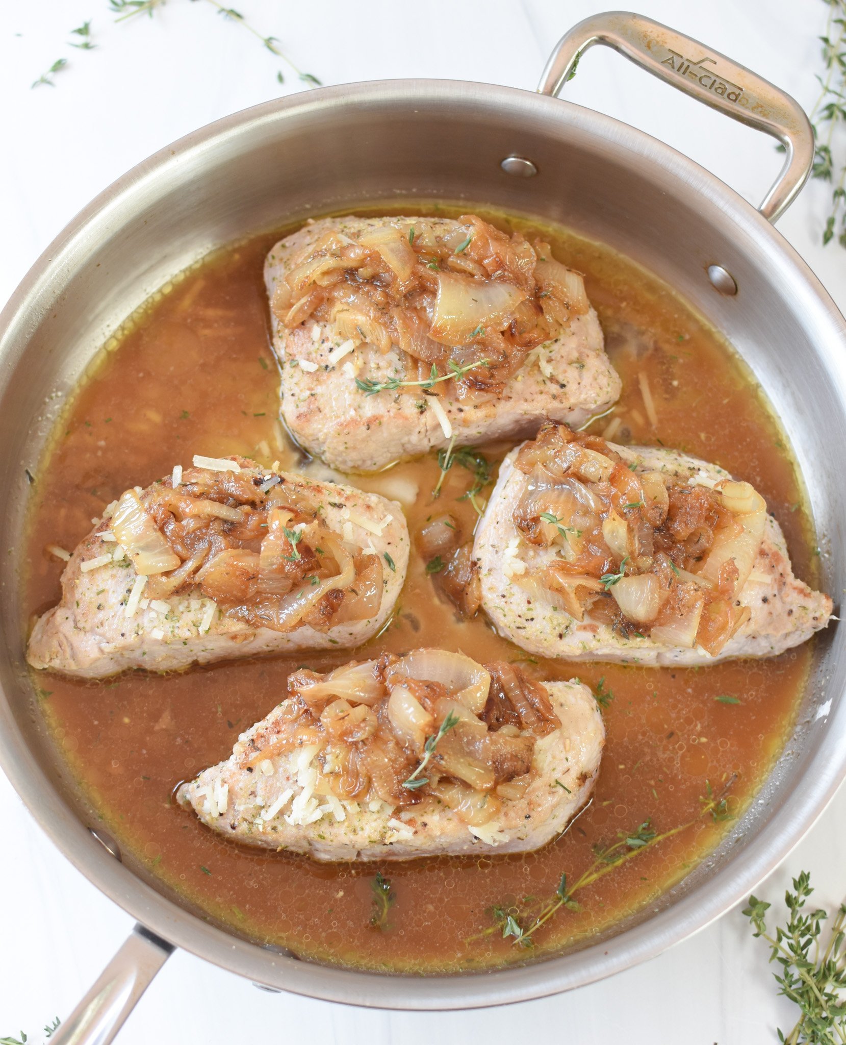 French Onion Pork Chops in a skillet 