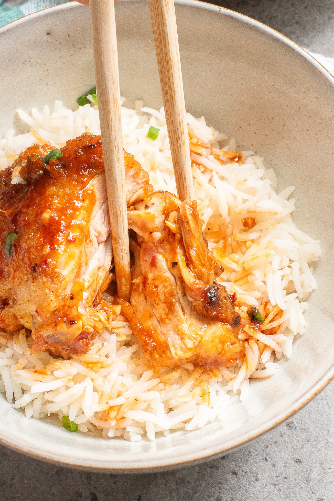 Honey Ginger Chicken with chopsticks in a bowl 