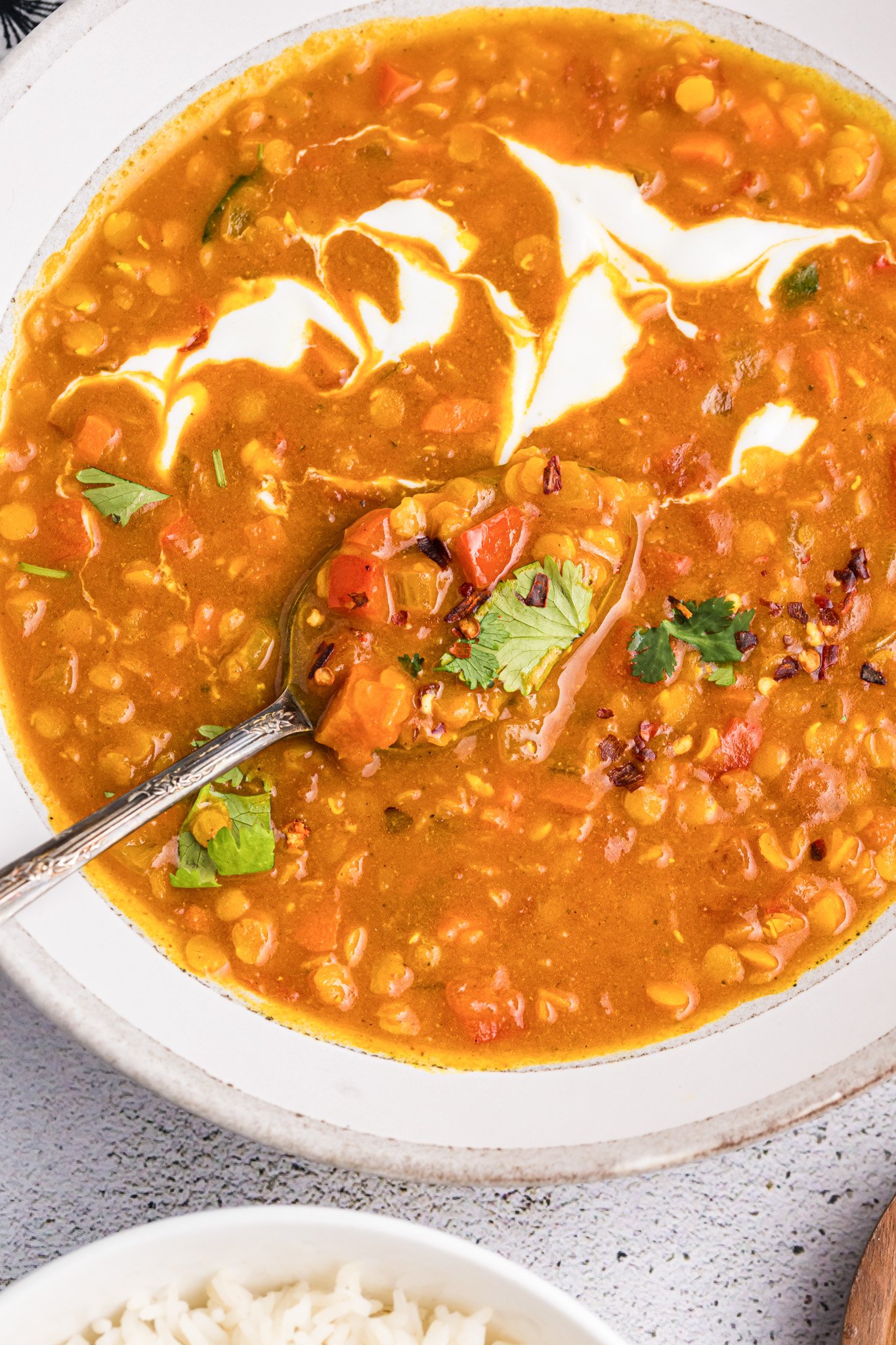 Easy Red Lentil Dahl Recipe in a bowl with Greek yogurt 