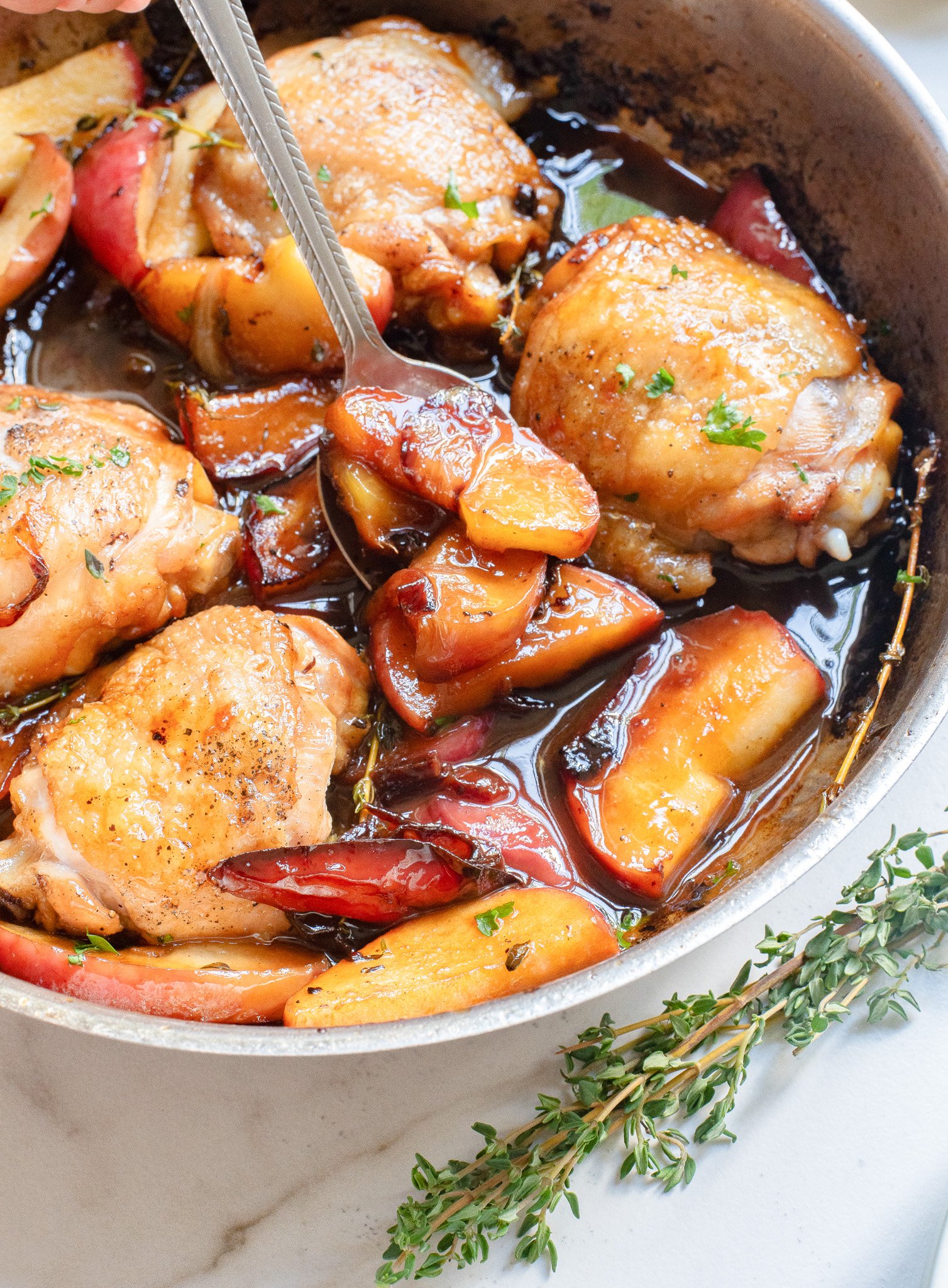 Skillet Apple Cider Chicken with a spoon