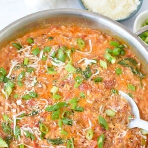 Creamy Cajun Sausage Rice Skillet with white spoon