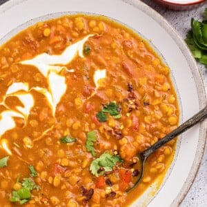 Easy Red Lentil Dahl Recipe with spoon in a bowl