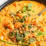 Sweet Potato Lentil Curry with a spoon in serving bowl
