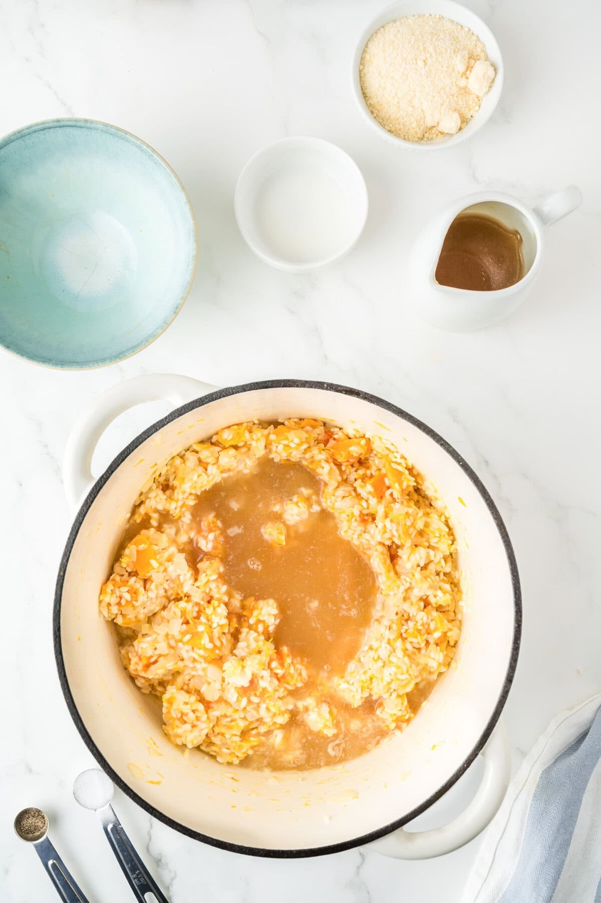 Butternut Squash Sage Risotto broth with rice in a pot