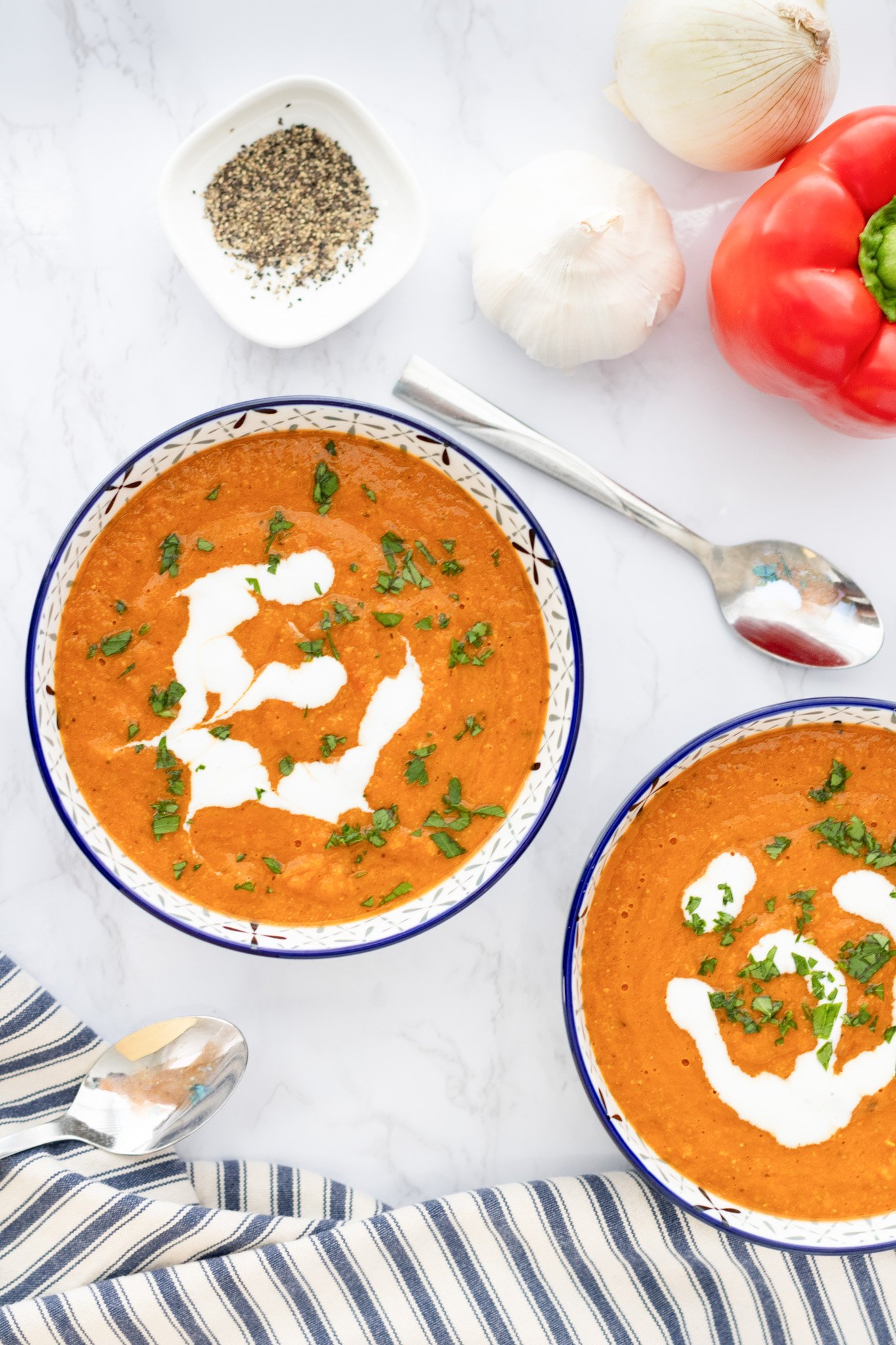 Lentil Tomato Soup two bowls of soup with spoon 