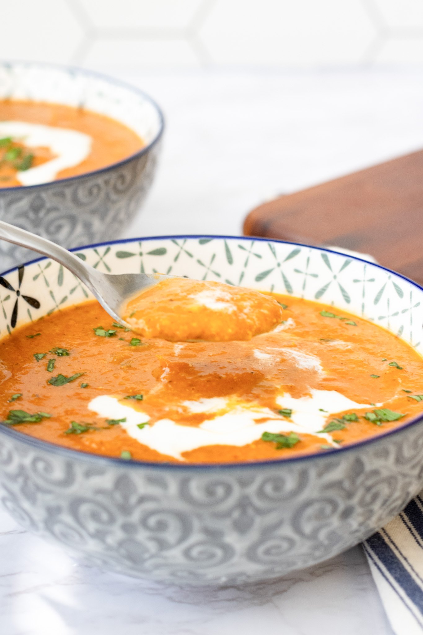 Lentil Tomato Soup with a spoon in the bowl