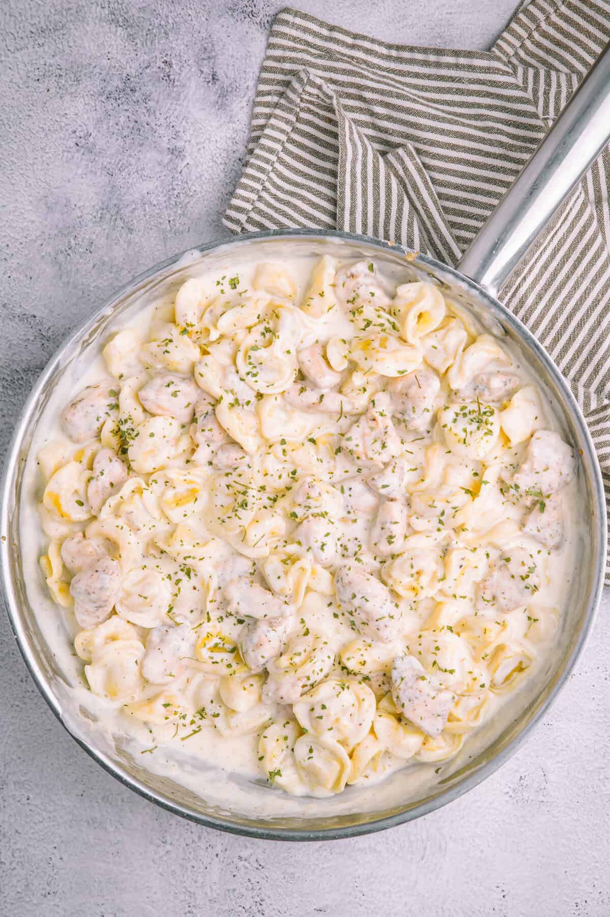 Olive Garden Chicken Tortellini Alfredo in a large skillet