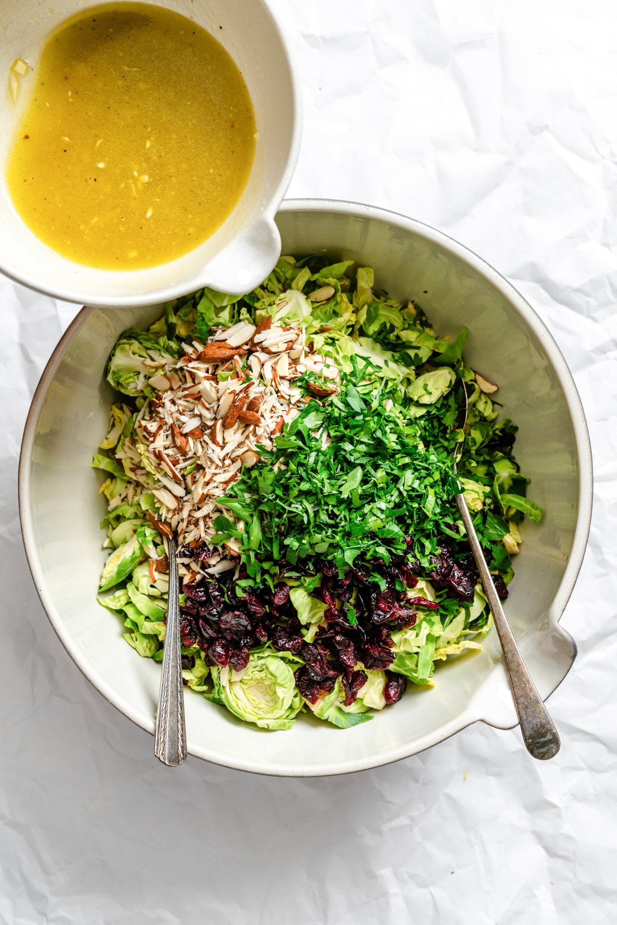 Brussels Sprout Slaw dressing going into salad
