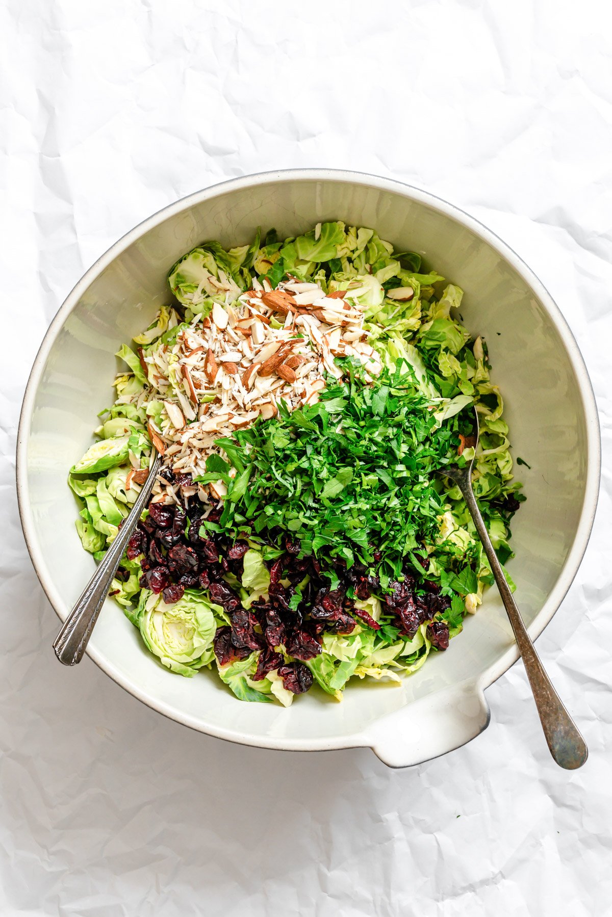 Brussels Sprout Slaw ingredients in a large bowl