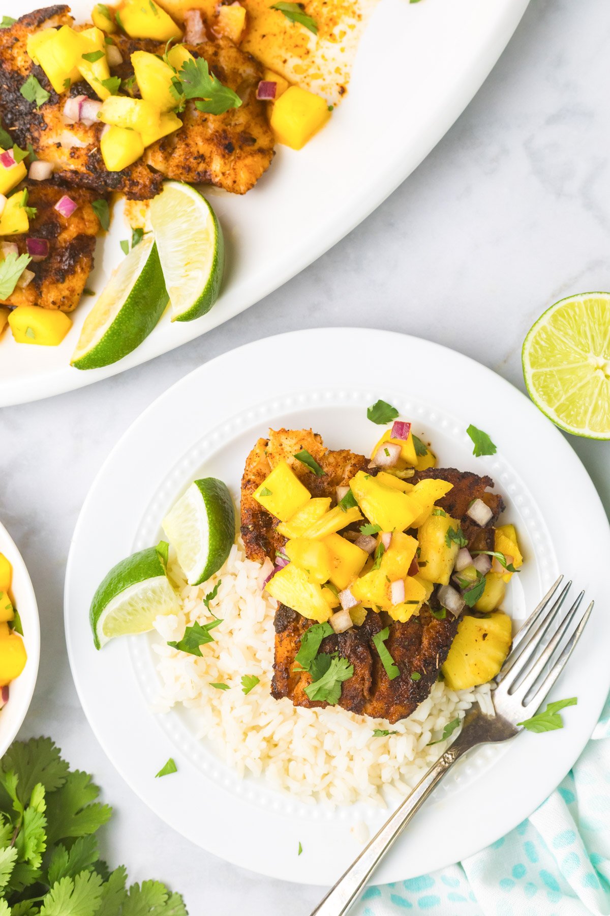 Easy Blackened Cod on a white plate with fork 