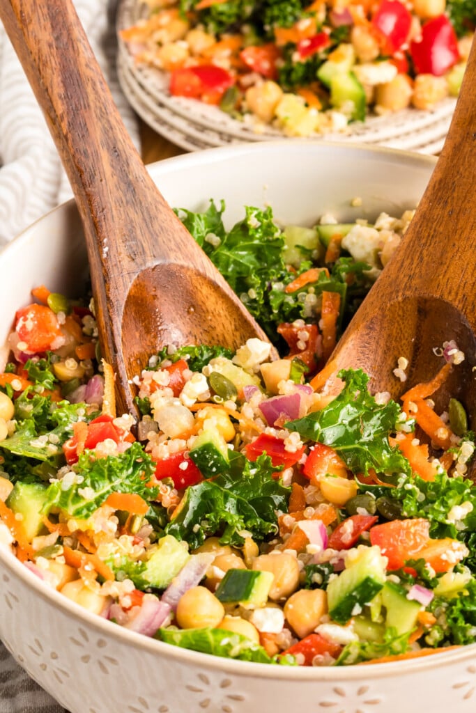 Kale Chickpea Salad with serving spoons in bowl