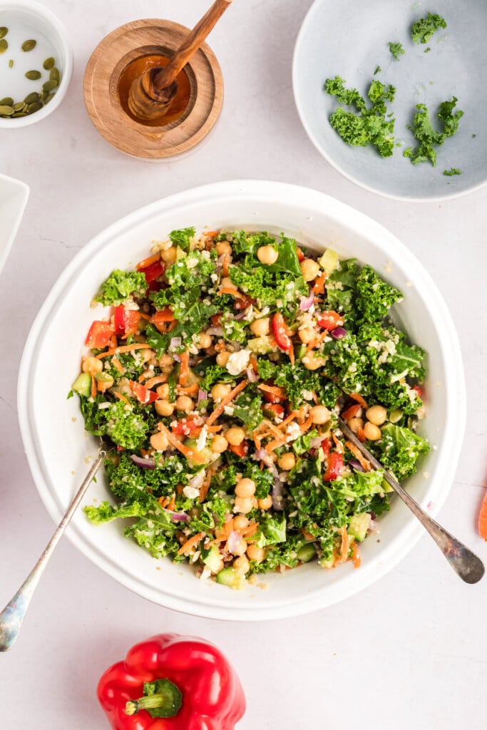 Kale Chickpea Salad ingredients in a bowl mixed together 