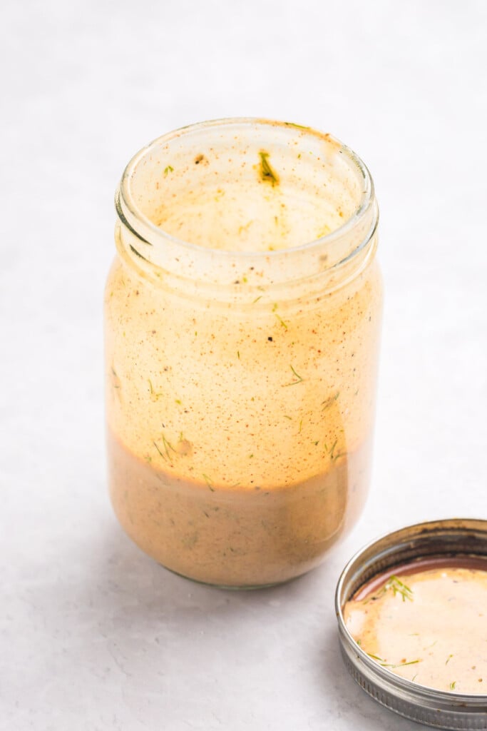 Mediterranean Tuna and Chickpea Salad dressing ingredients in a mason jar 