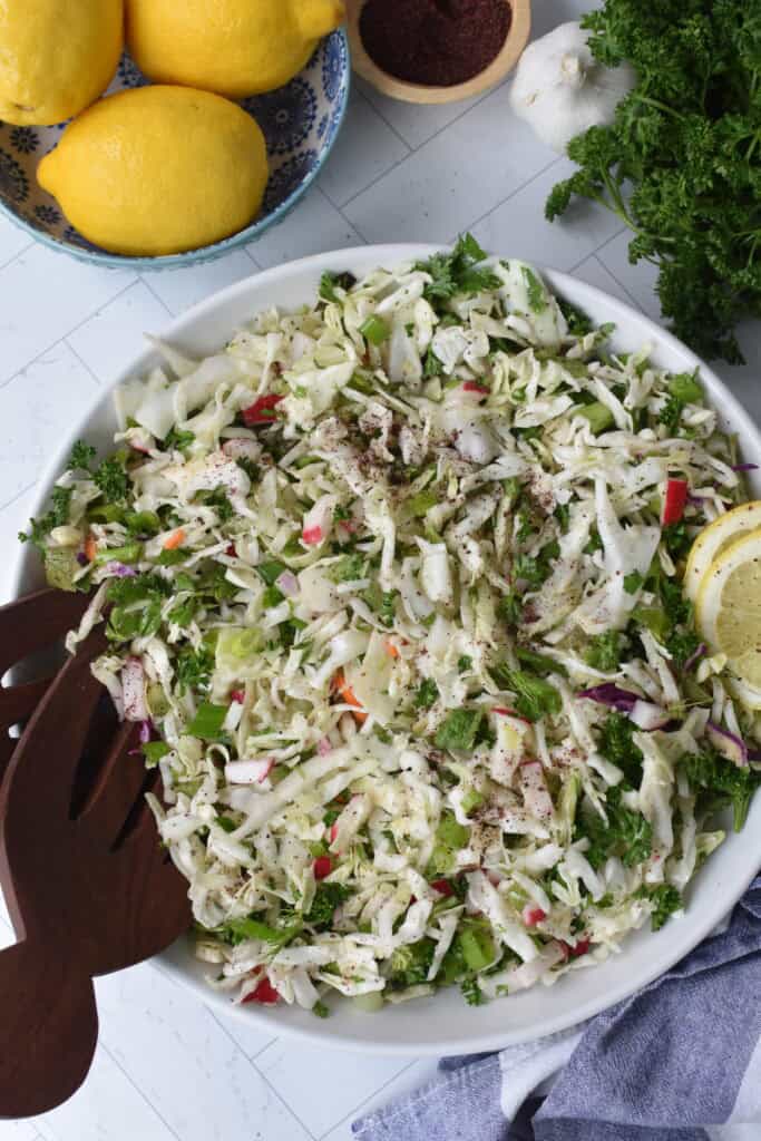 Malfouf Salad in a white bowl with fork 