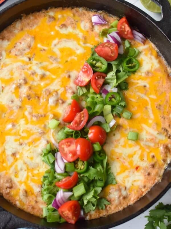 Cottage Cheese Queso in a skillet with garnishes 1200 x 1200