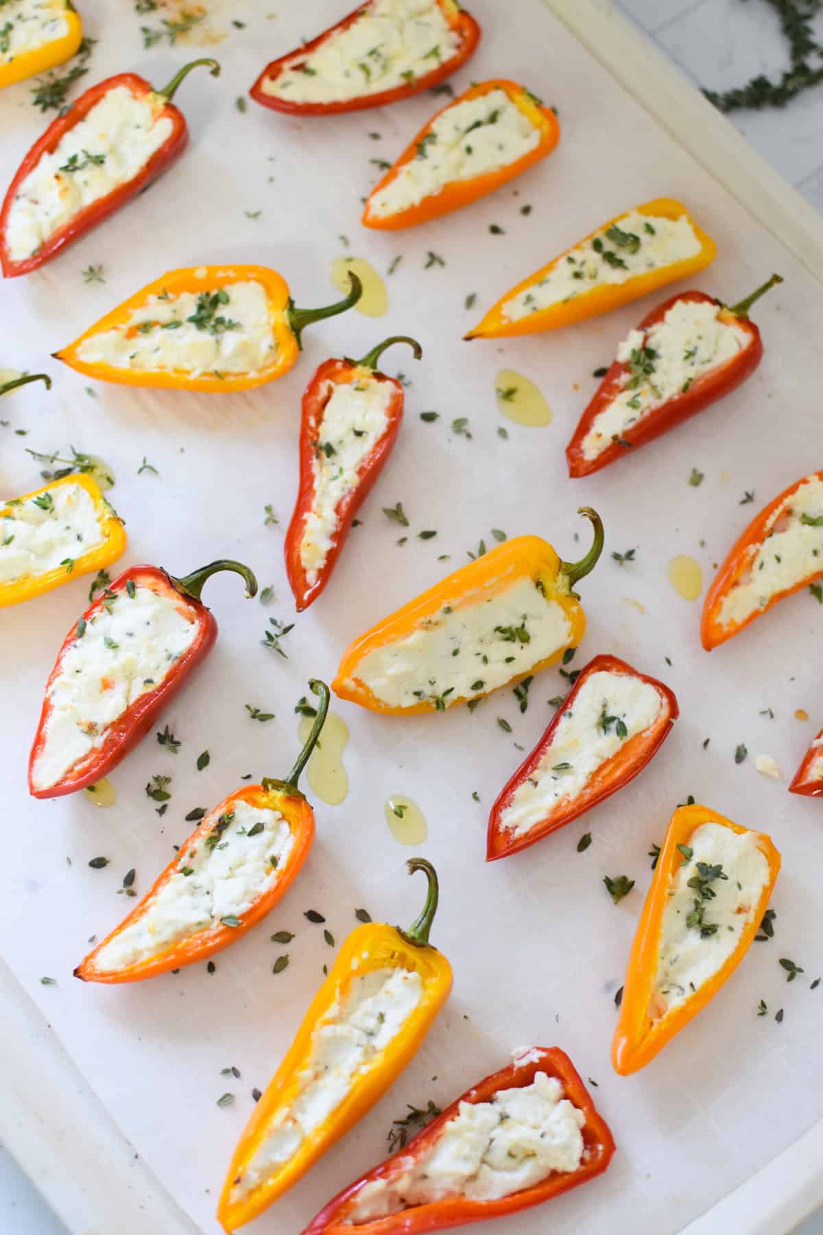 Goat Cheese Stuffed Mini Peppers baked on a baking sheet