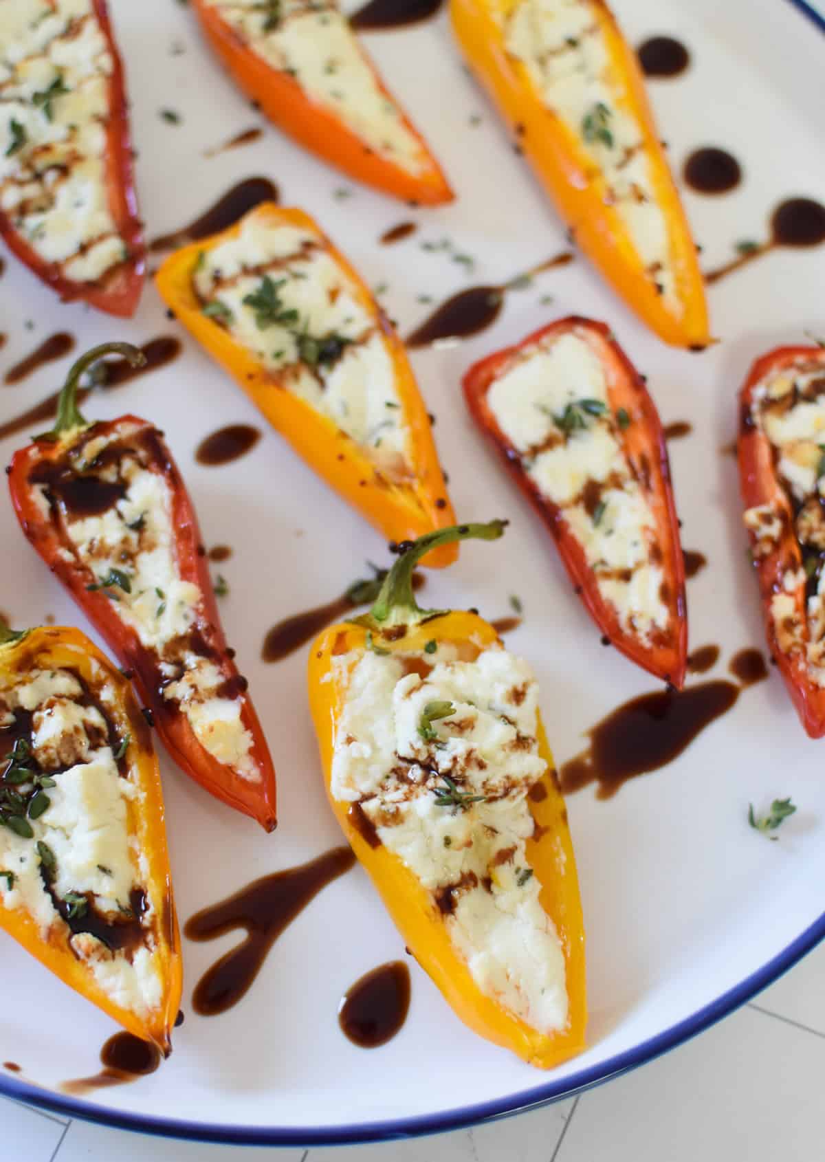 Goat Cheese Stuffed Mini Peppers on a white and blue plate