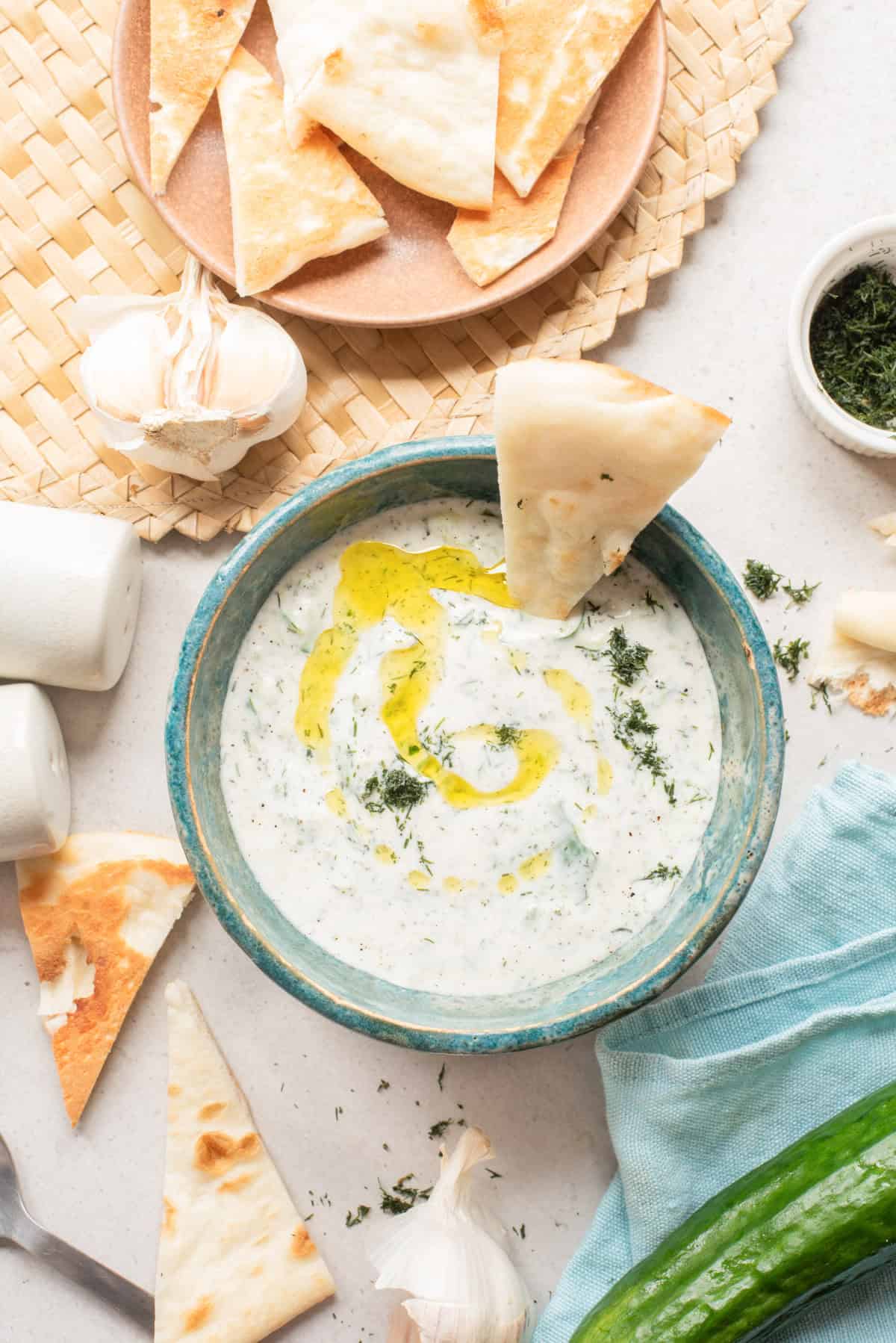 Cucumber Garlic Yogurt Sauce in a bowl with pita 