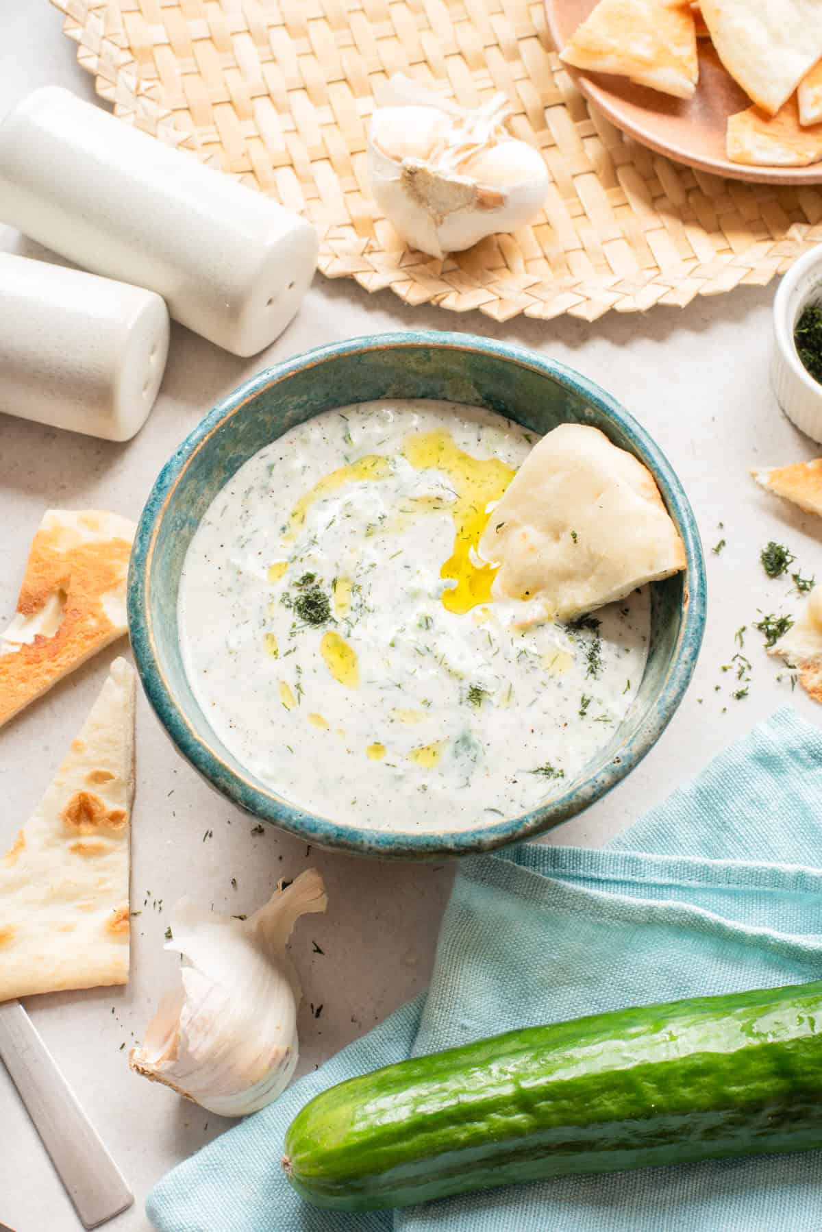 Traditional Greek Tzatziki sauce in a blue dish 