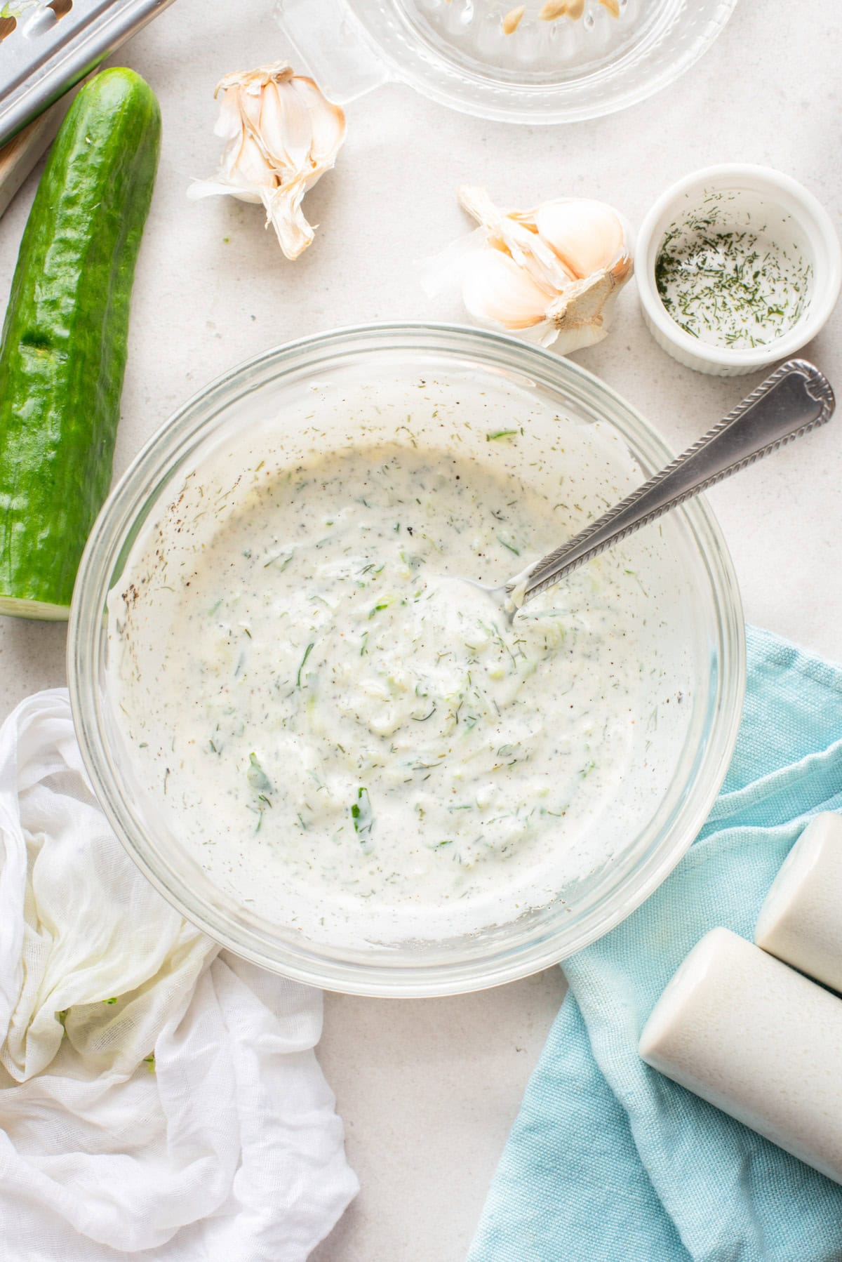Greek cucumber dip in a bowl with a spoon 