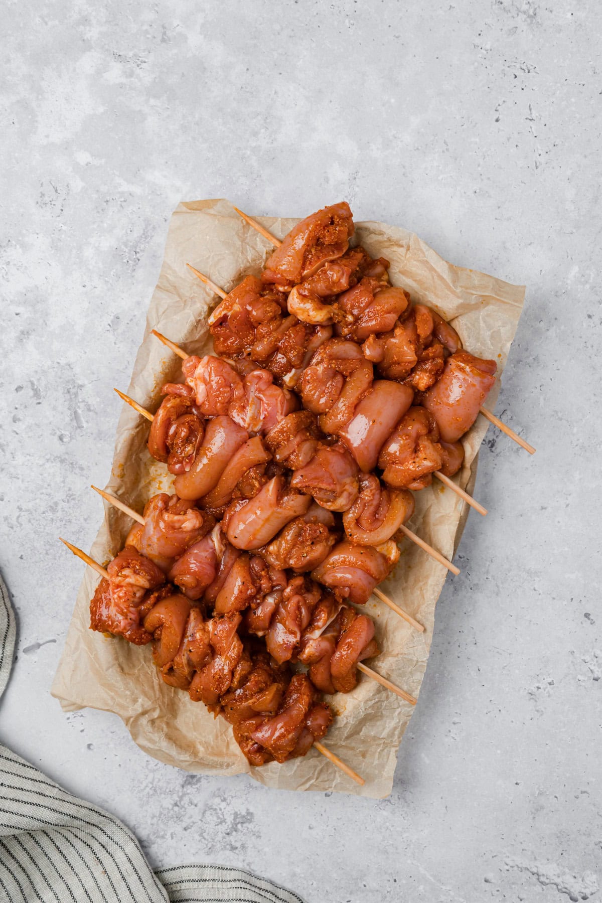 Garlic Parmesan Chicken Skewers threaded onto skewers 