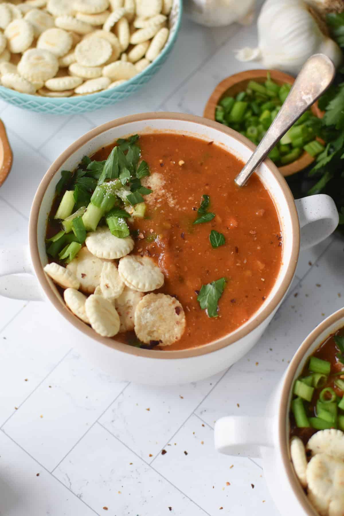 slow cooker 15 bean soup in a white bowl with a spoon 