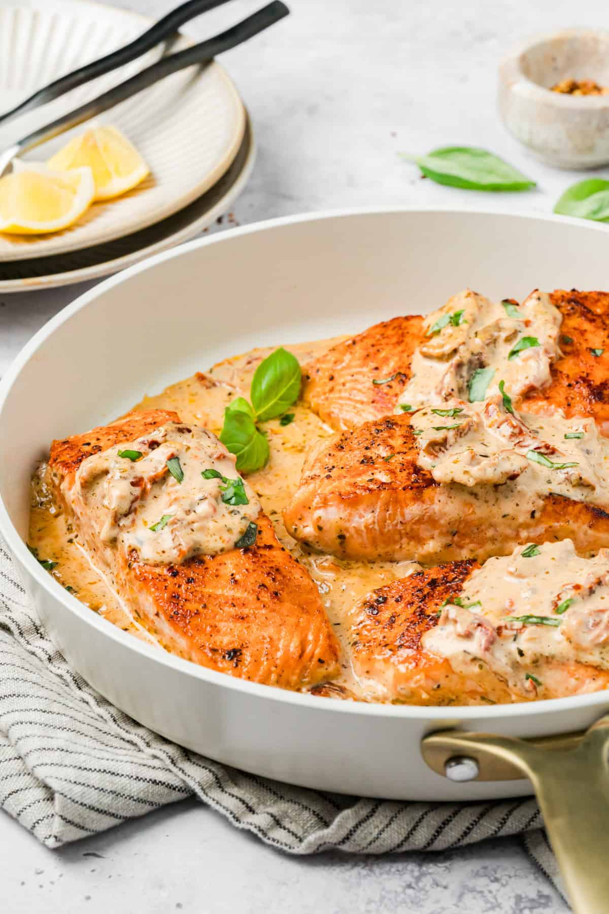 Easy Marry Me Salmon with fresh Basil in a skillet