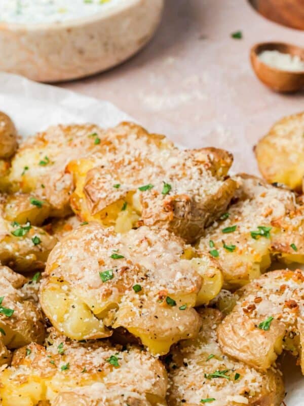 Garlic Parmesan Smashed Potatoes on a board