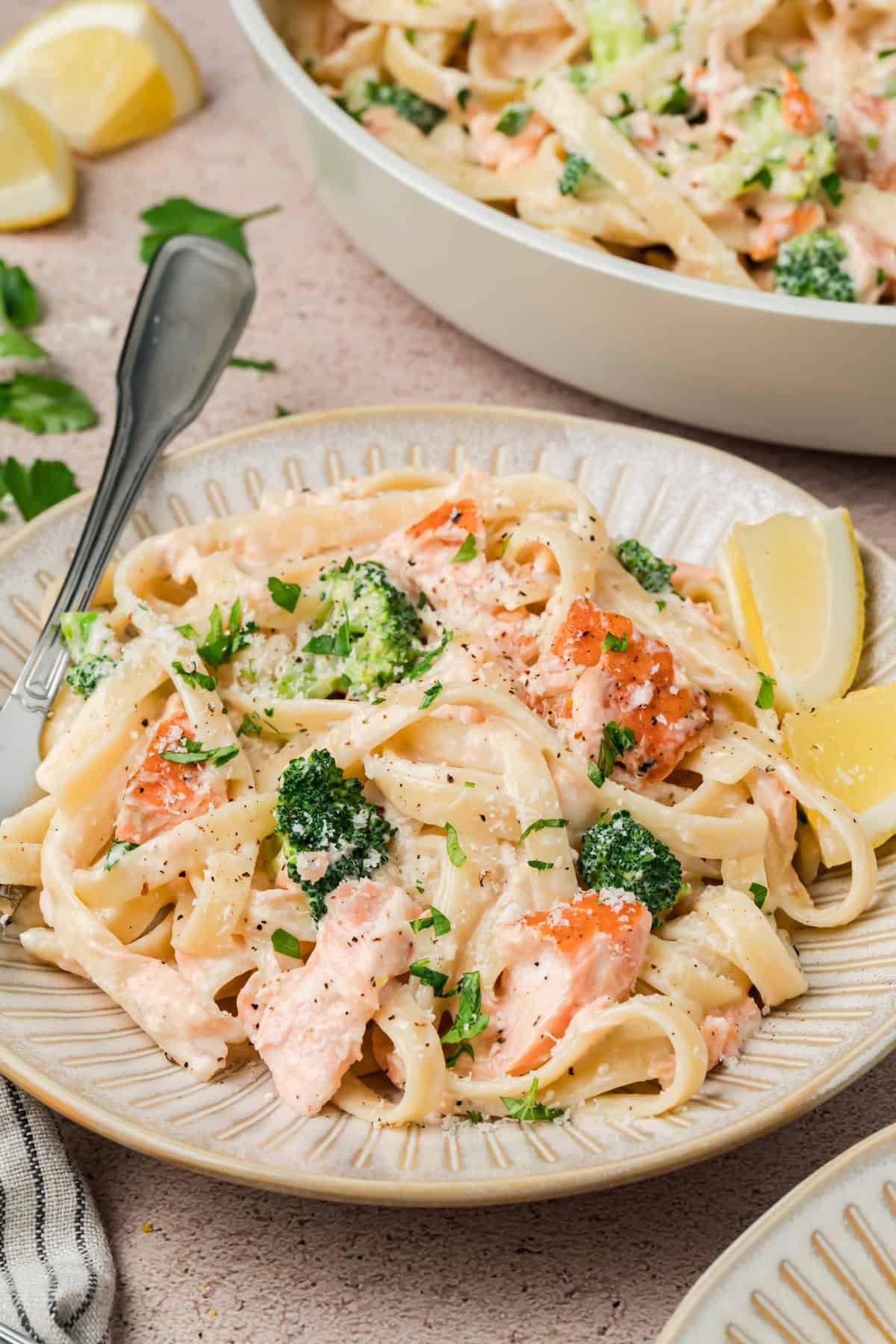 Salmon Alfredo Pasta with tender broccoli and lemon
