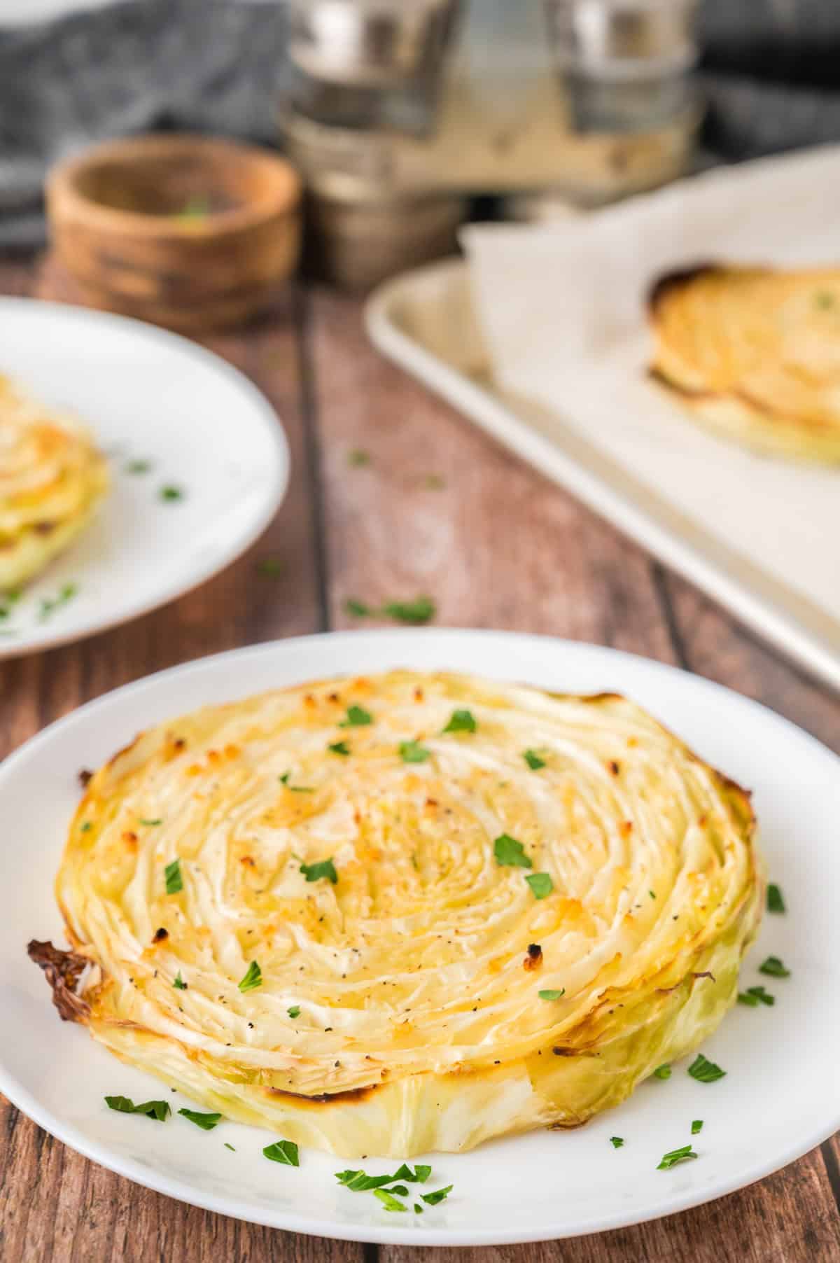 Crispy Roasted Cabbage Steaks on a white plate 