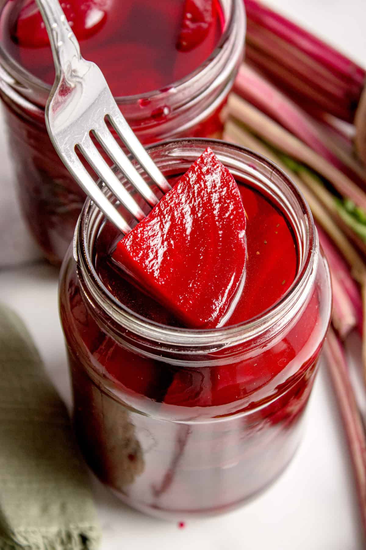 Quick pickled beets in a glass jar with deep ruby brine