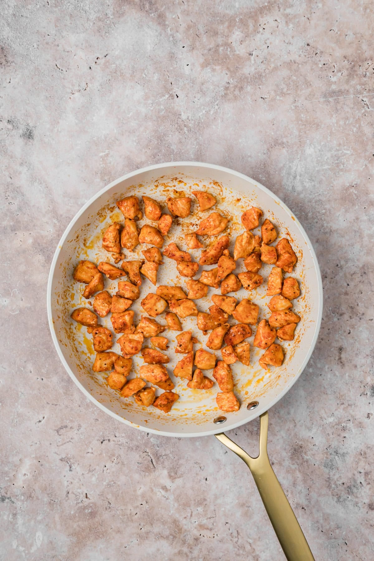 Marry Me Chicken with chicken in a skillet