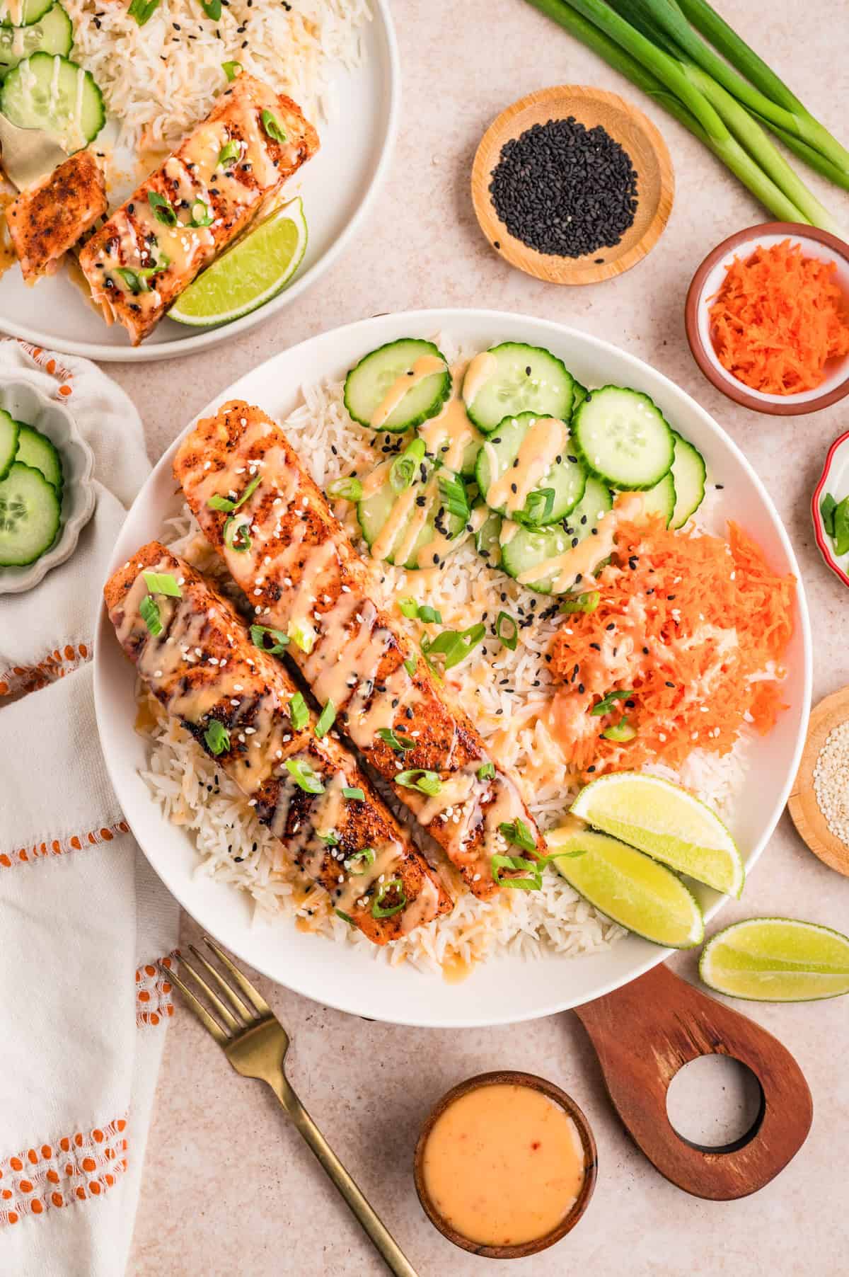 Close up of bang bang salmon fillet showing golden seared crust with creamy orange sauce