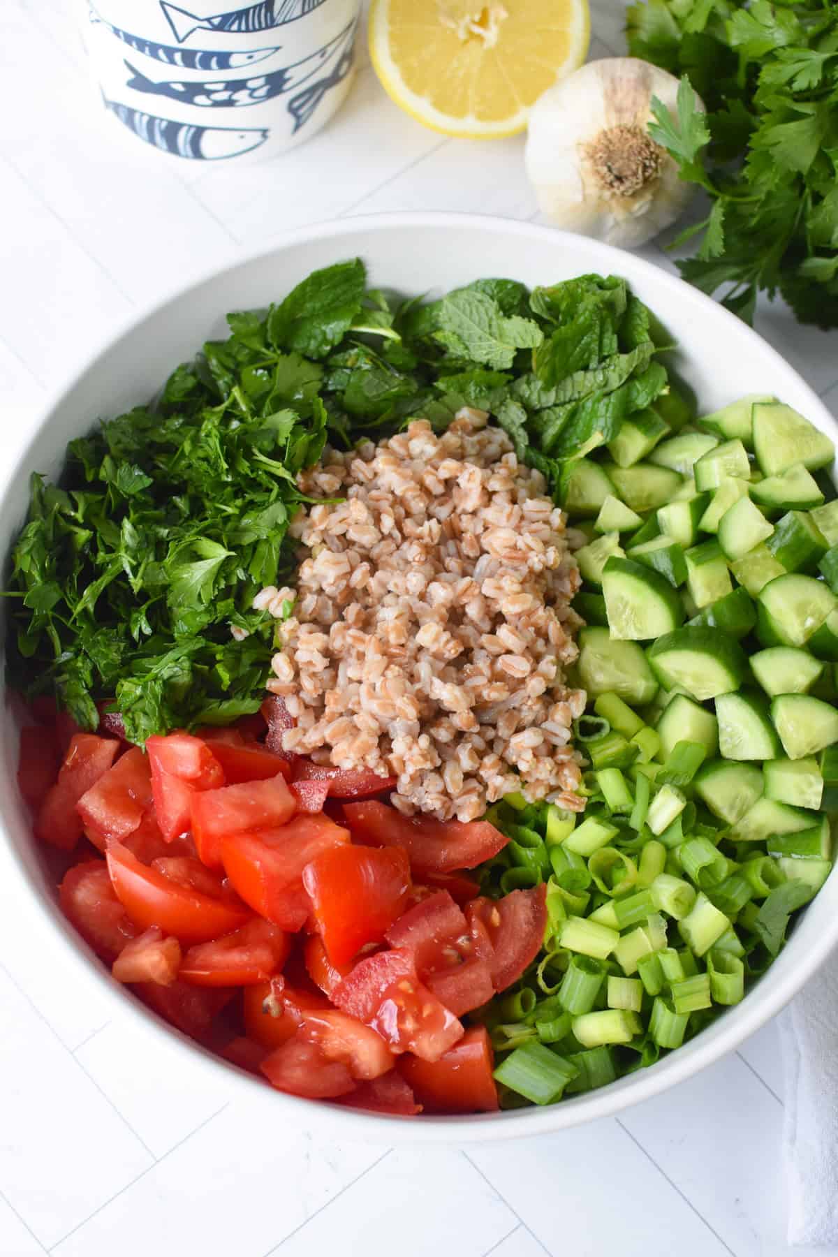 Simple Farro Tabbouleh Salad in a glass bowl