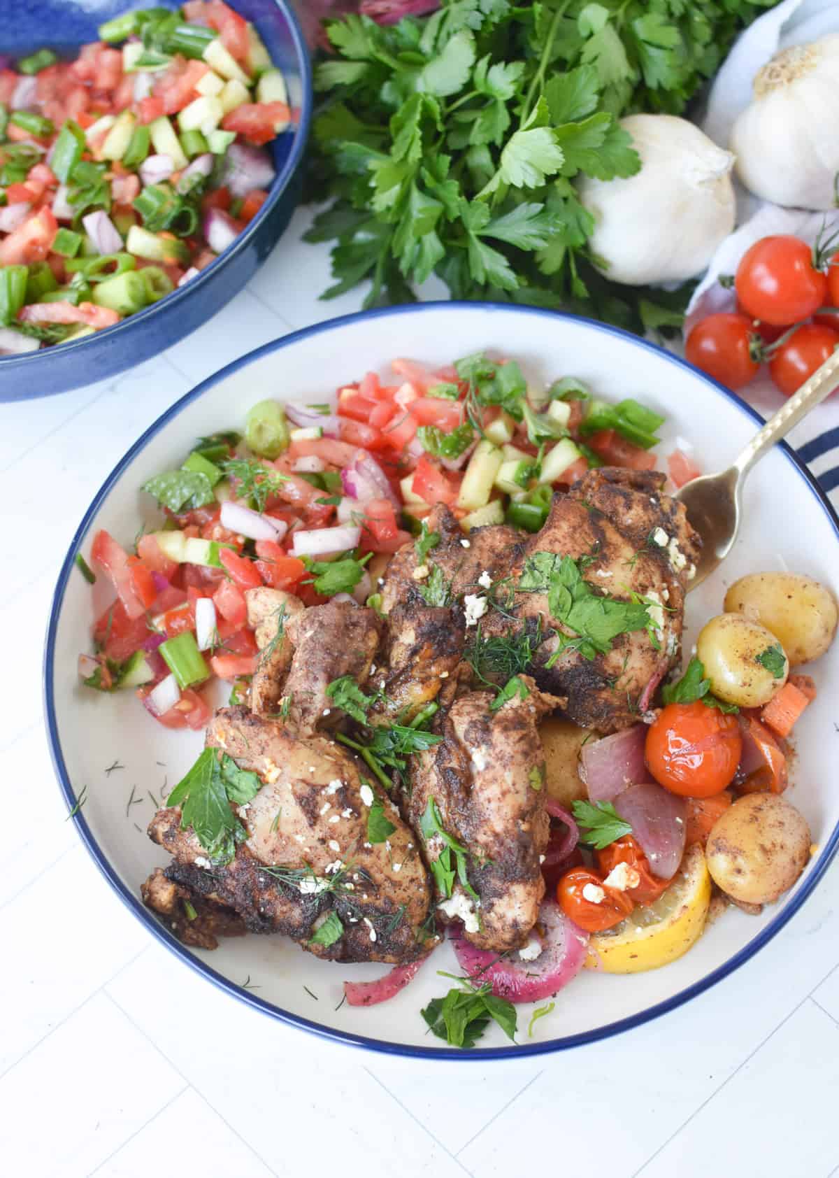 Baked Lebanese baharat chicken with roasted vegetables fresh from the oven