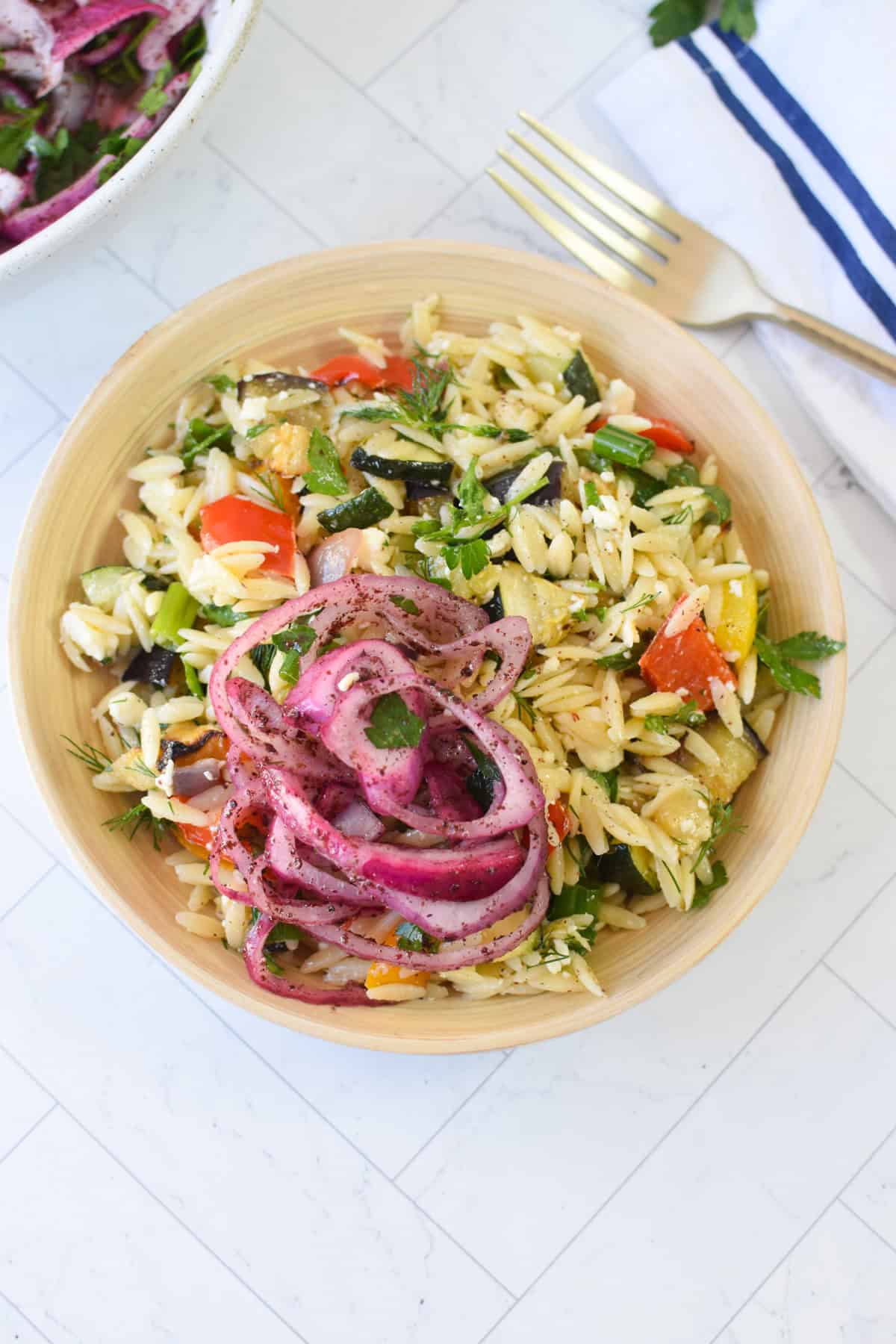 Mediterranean roasted vegetable orzo salad with crumbled feta and lemon herb dressing