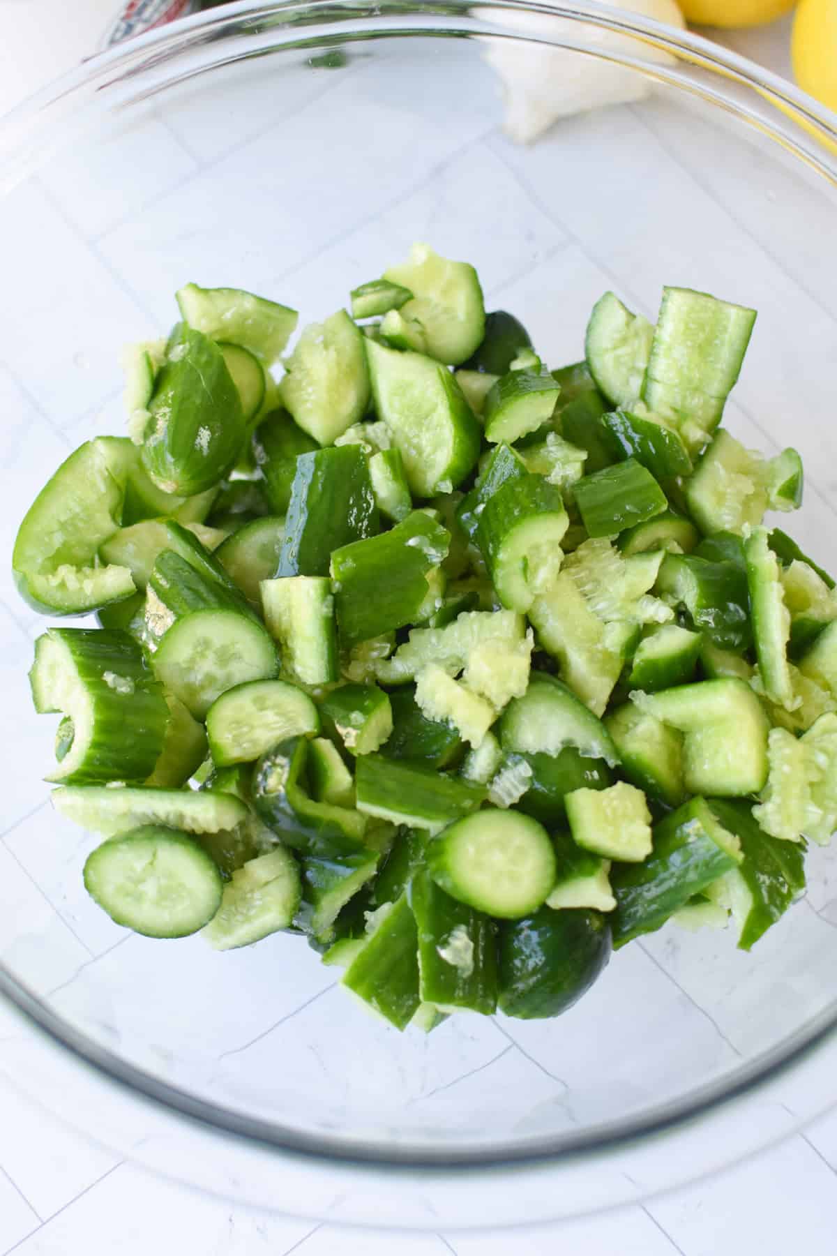 Cucumbers in a glass bowl with salt