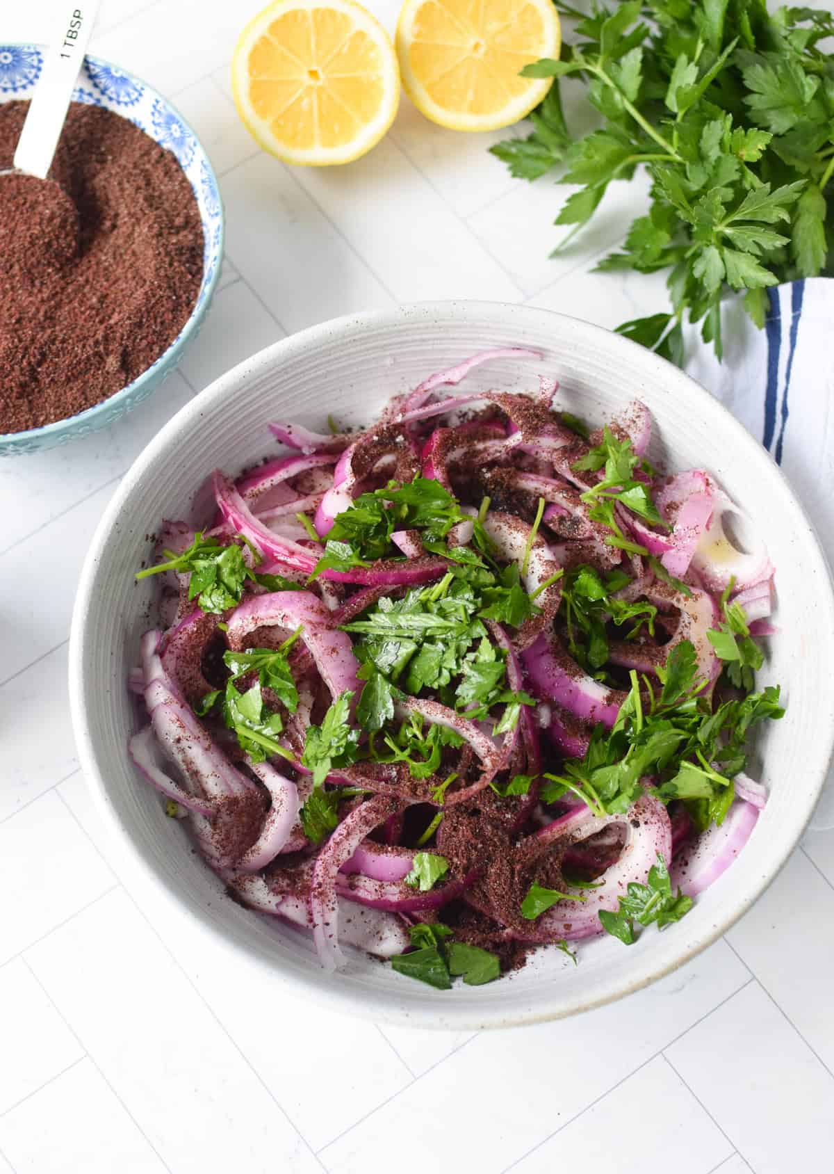 Sumac Red Onions with parsley before massaging