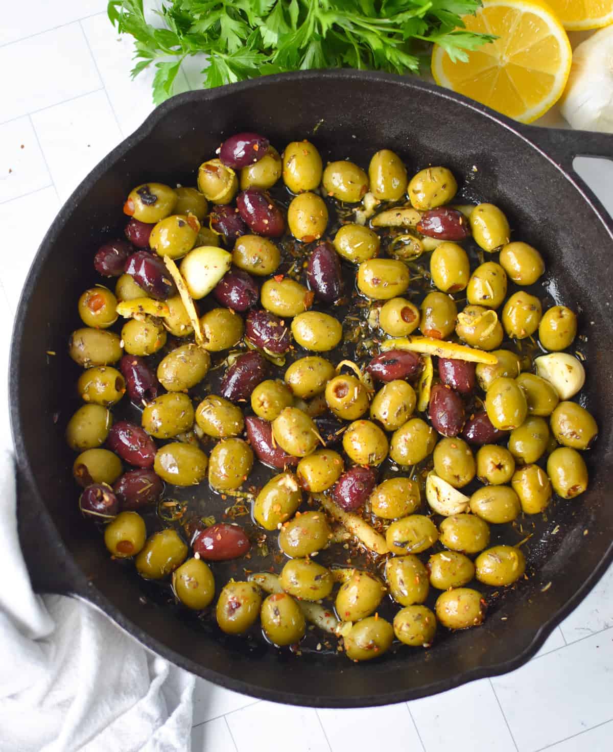 Warm Olives with Mediterranean Herbs in a Cast Iron Skillet