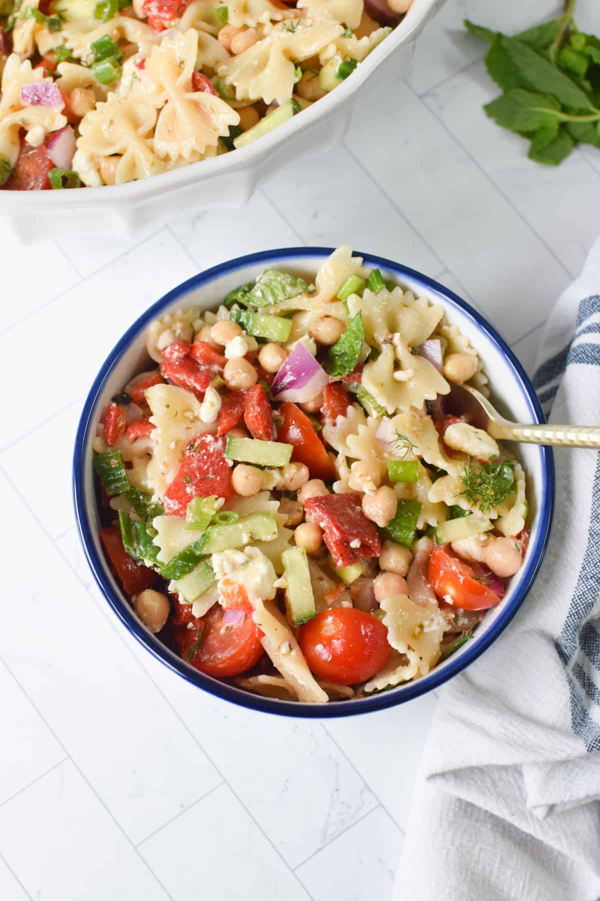 Mediterranean bow tie pasta salad with mint, dill, and lemon olive oil dressing