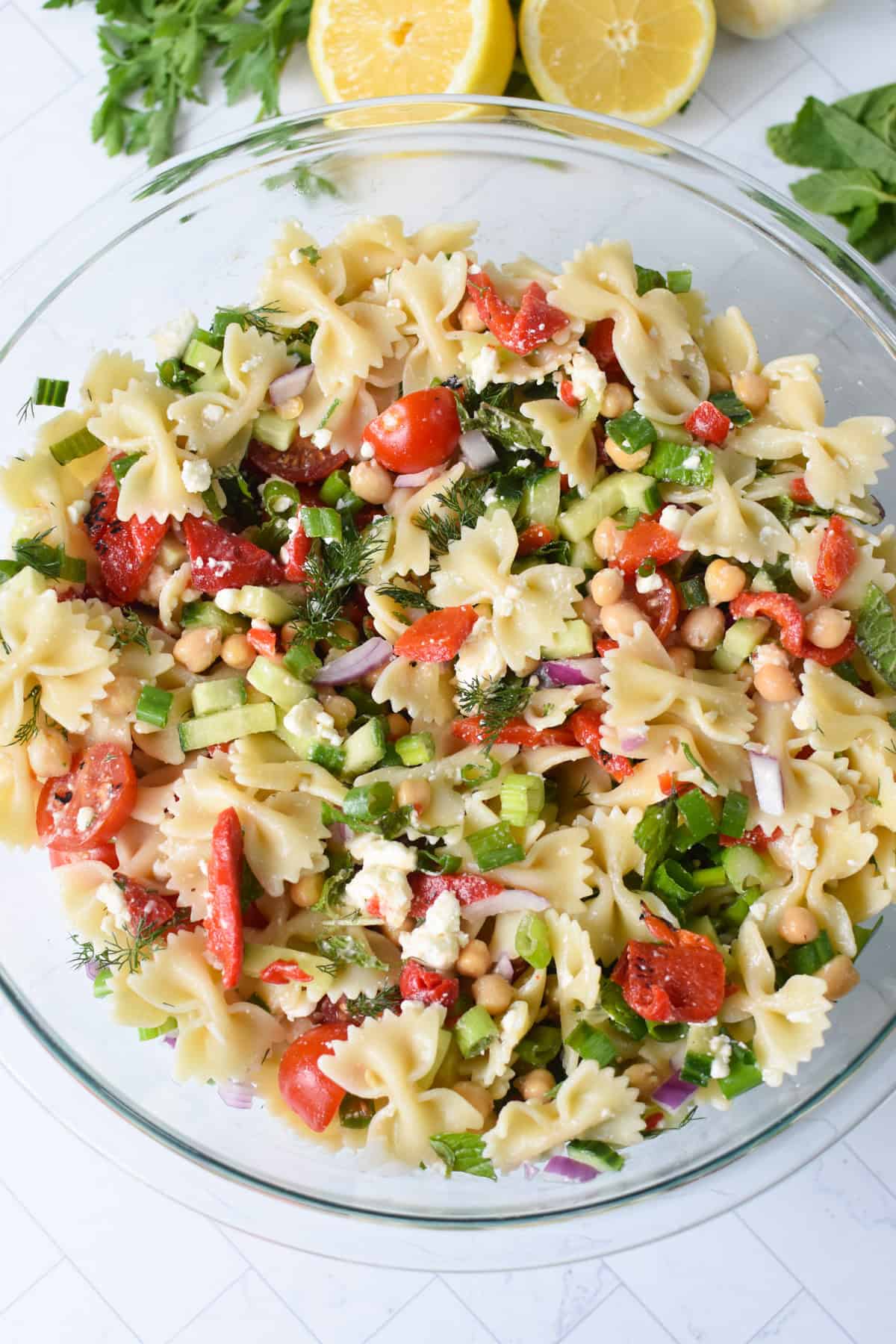 Easy Mediterranean Bowtie Pasta Salad in a glass bowl