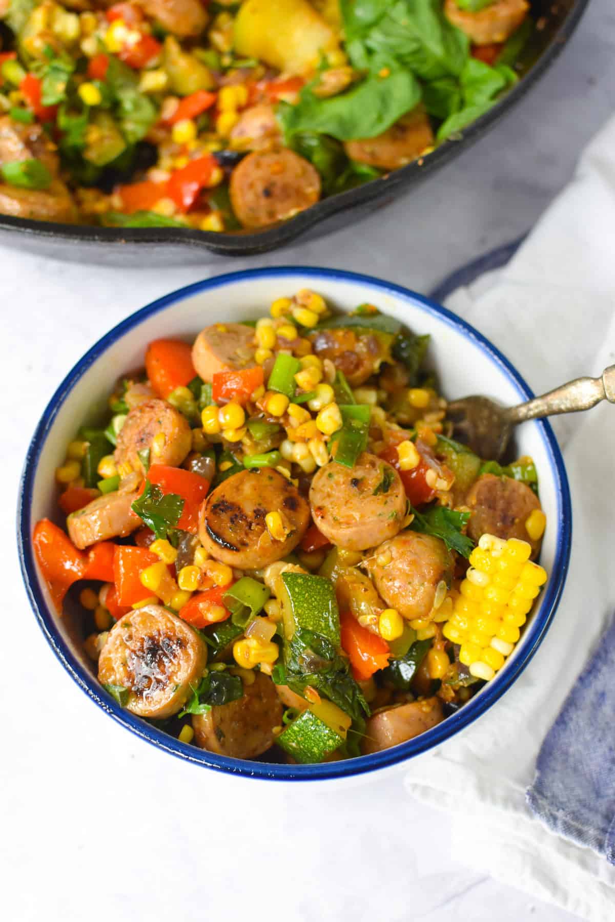 Sausage Veggie Skillet in a white and blue bowl