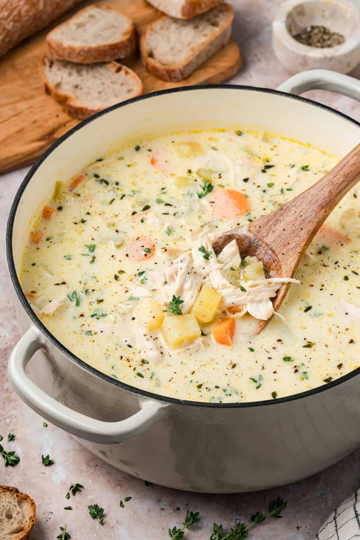 Easy Chicken Potato Soup with a spoon showing chicken