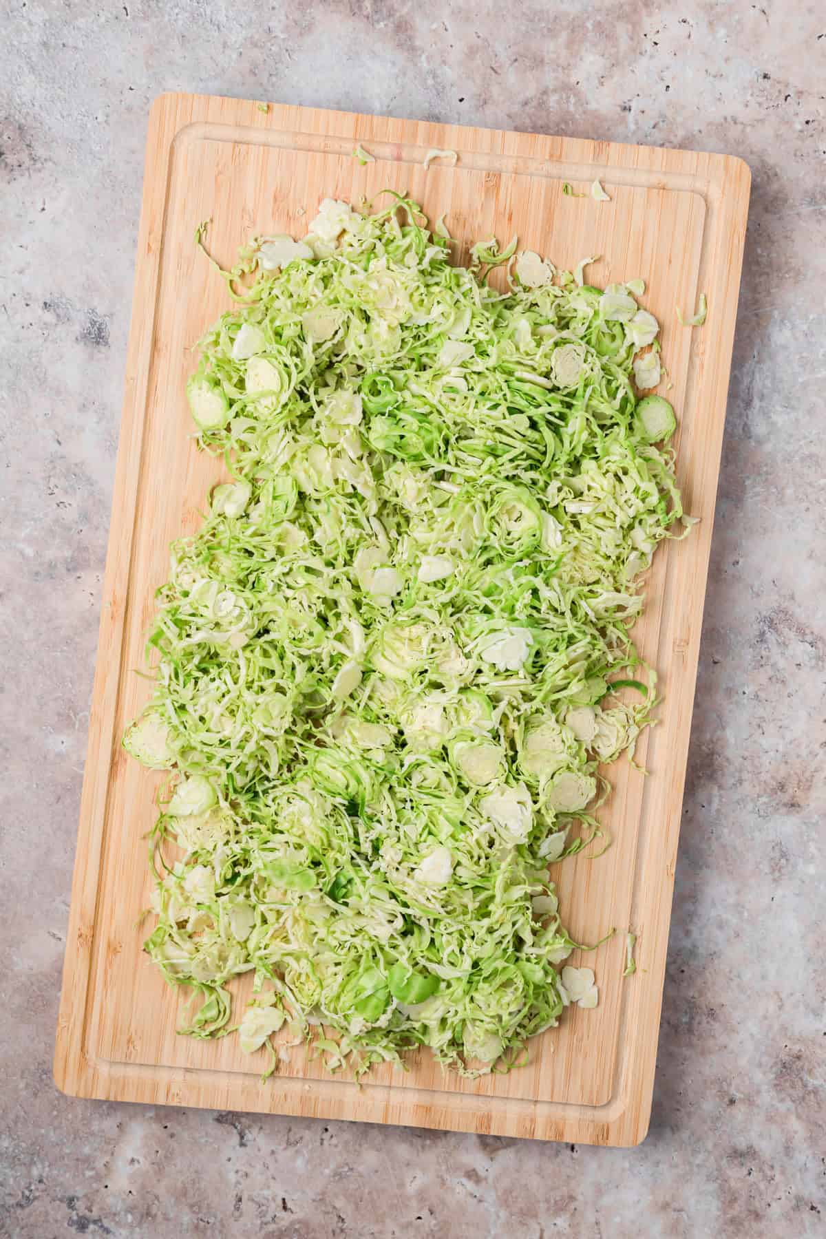 Shaved Brussels Sprouts on a cutting board