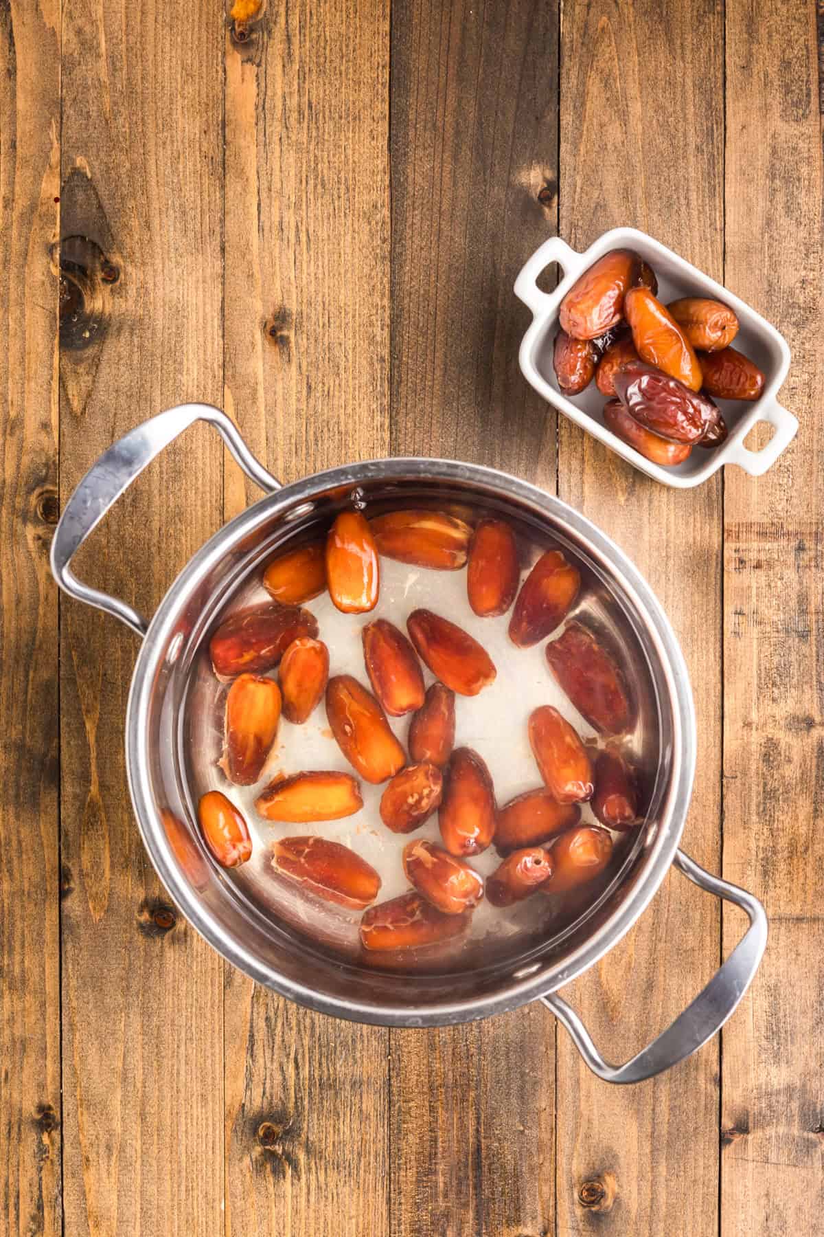 Dates soaking in a pot with water